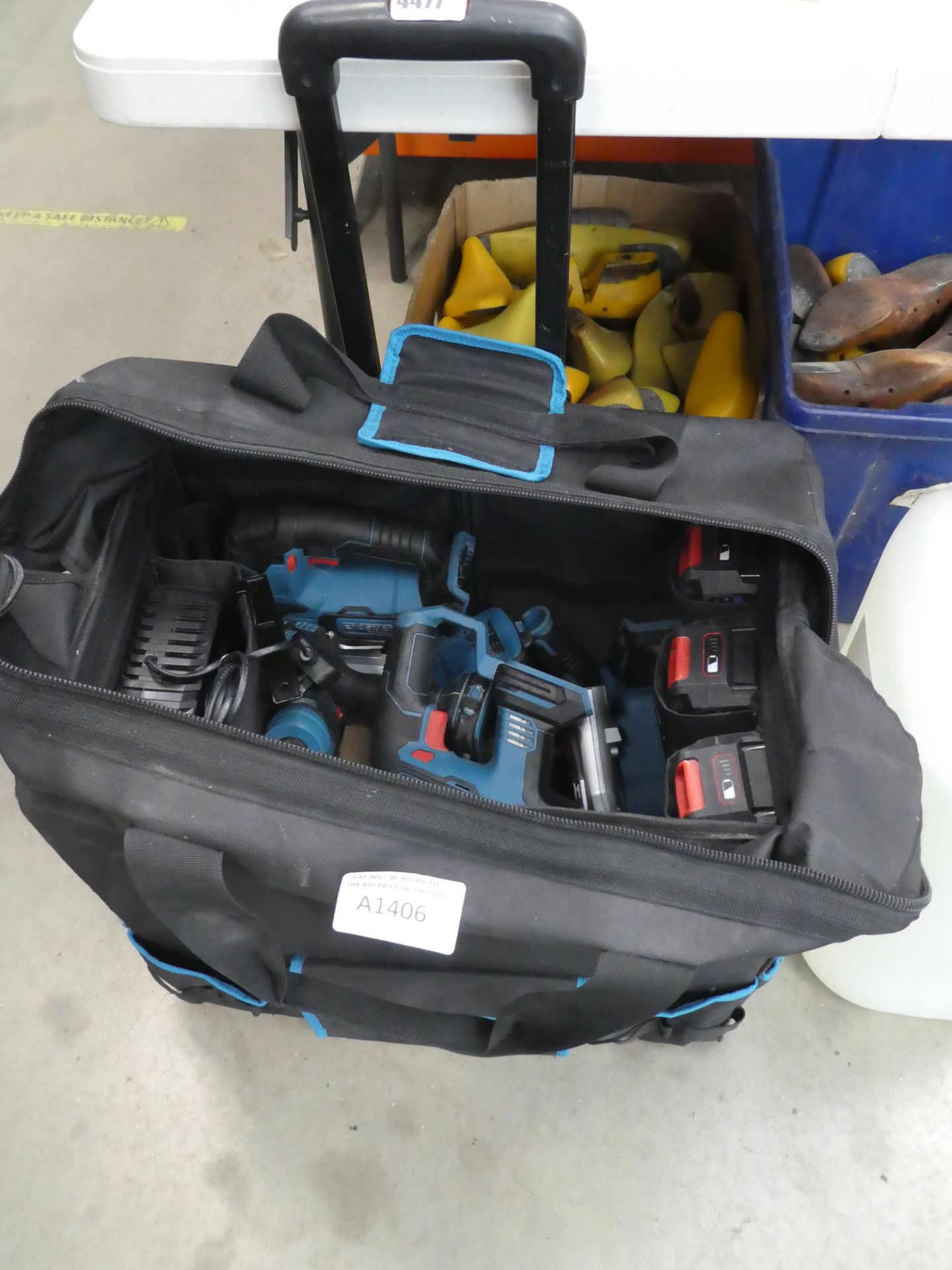 Erbauer toolbox containing three batteries, chargers, drills, jigsaws, grinder etc