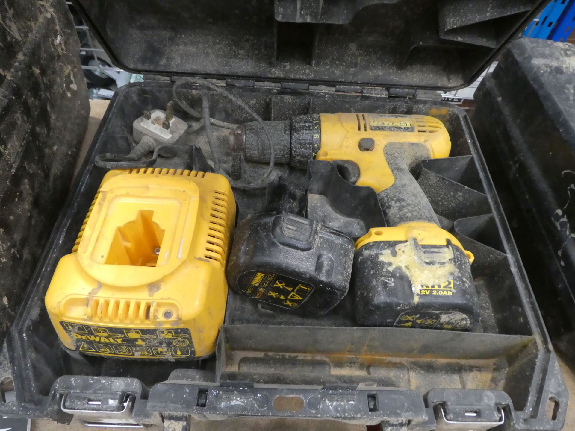 DeWalt cordless drill with two batteries and a charger