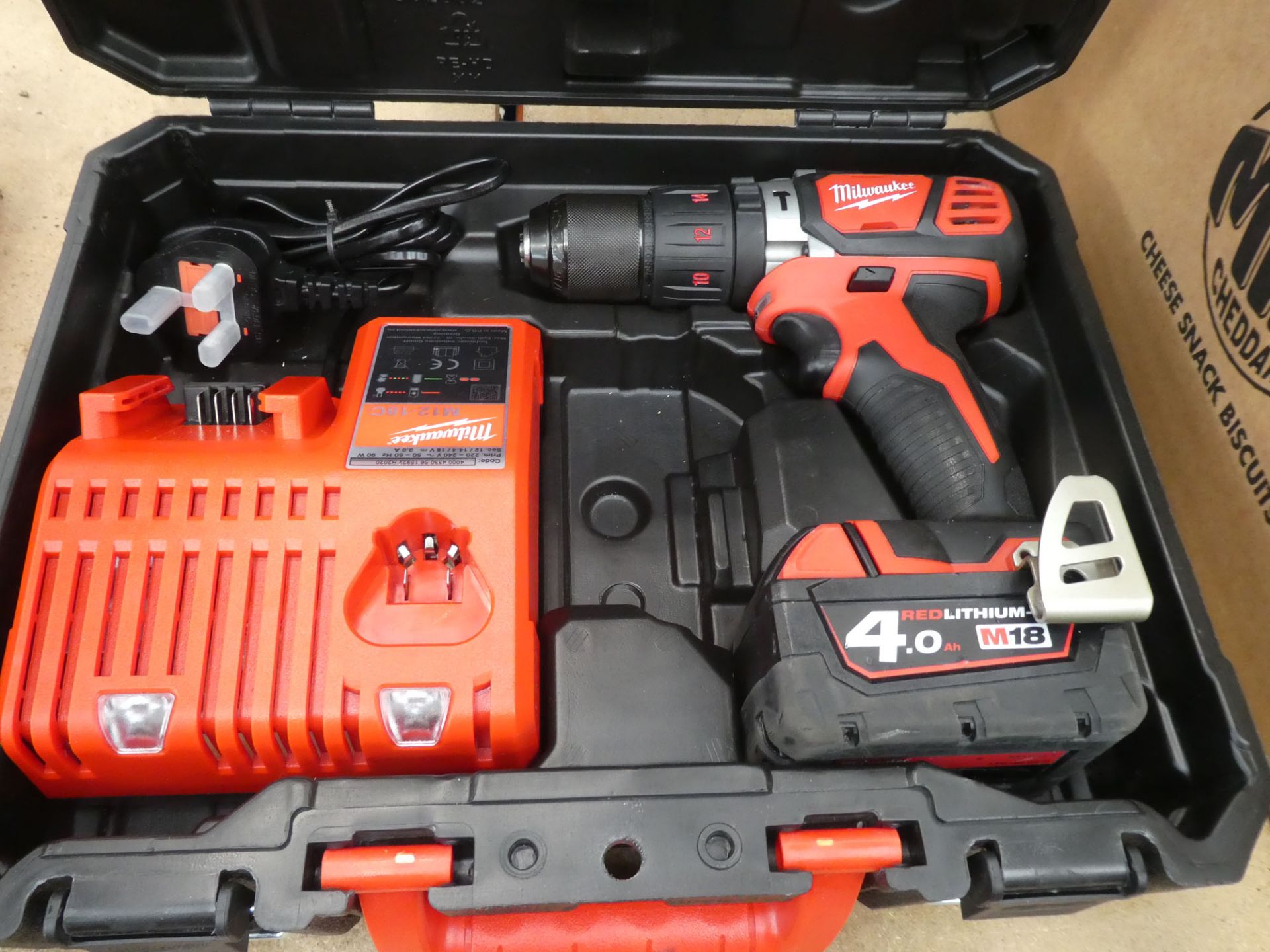 Milwaukee cordless drill with a battery and charger