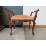 Brown upholstered carved stool