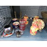 Cage containing a pair of brass candlesticks, paperweight, Poole pottery dish, Royal Brierley pot,