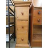 Narrow three drawer storage cabinet