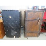 Leather bound travelling trunk plus a black painted trunk