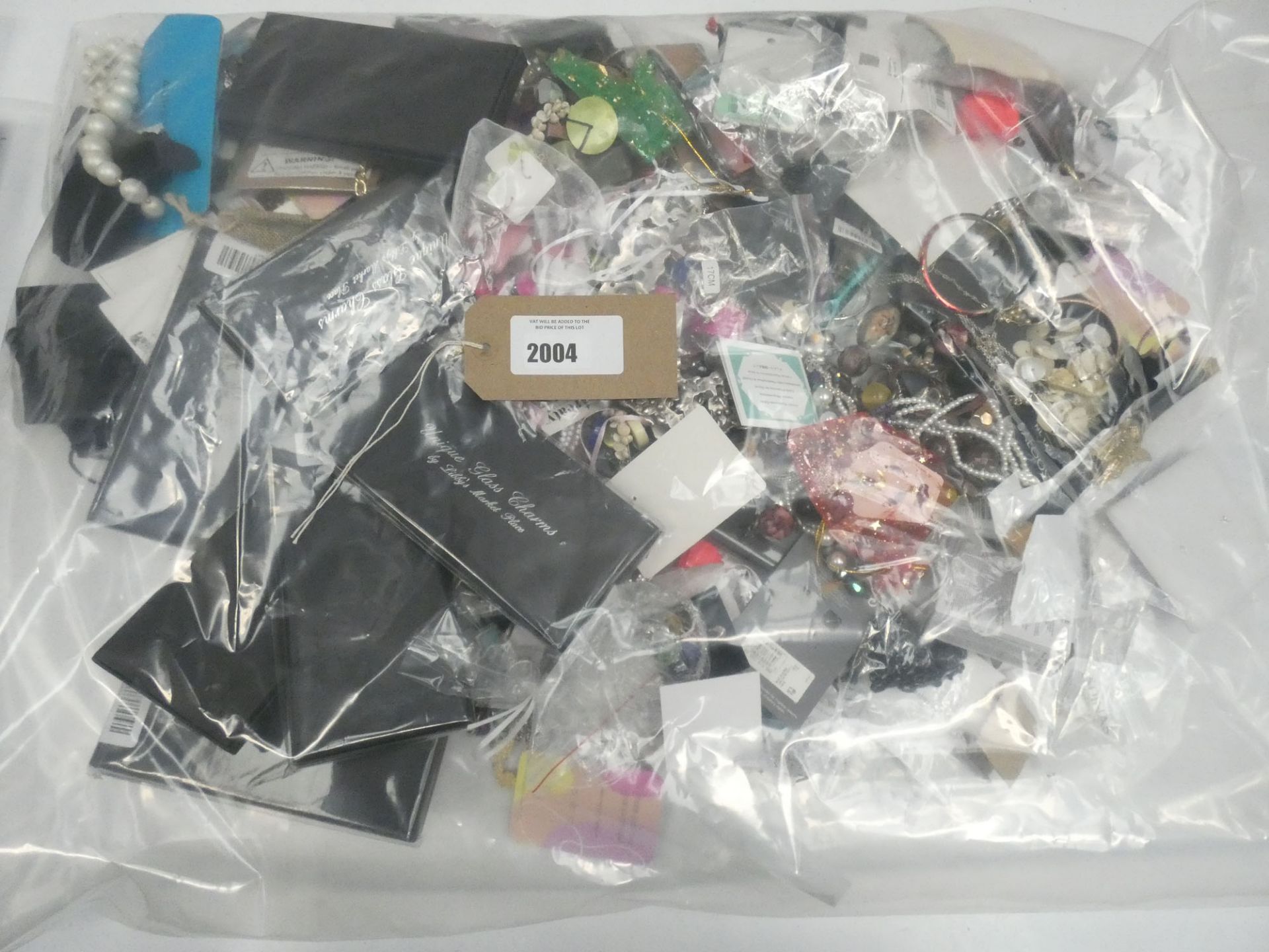 Bag containing quantity of loose costume and dress jewellery