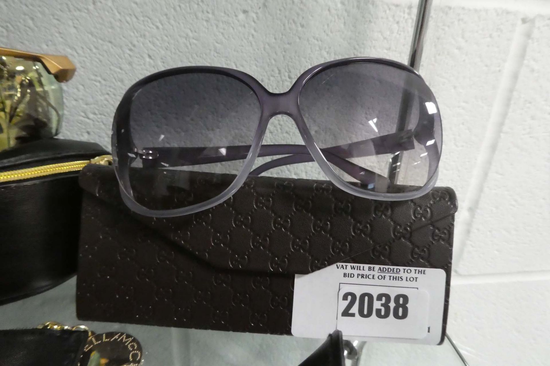 Pair of ladies Gucci sunglasses in purple frames with case, GG0506S
