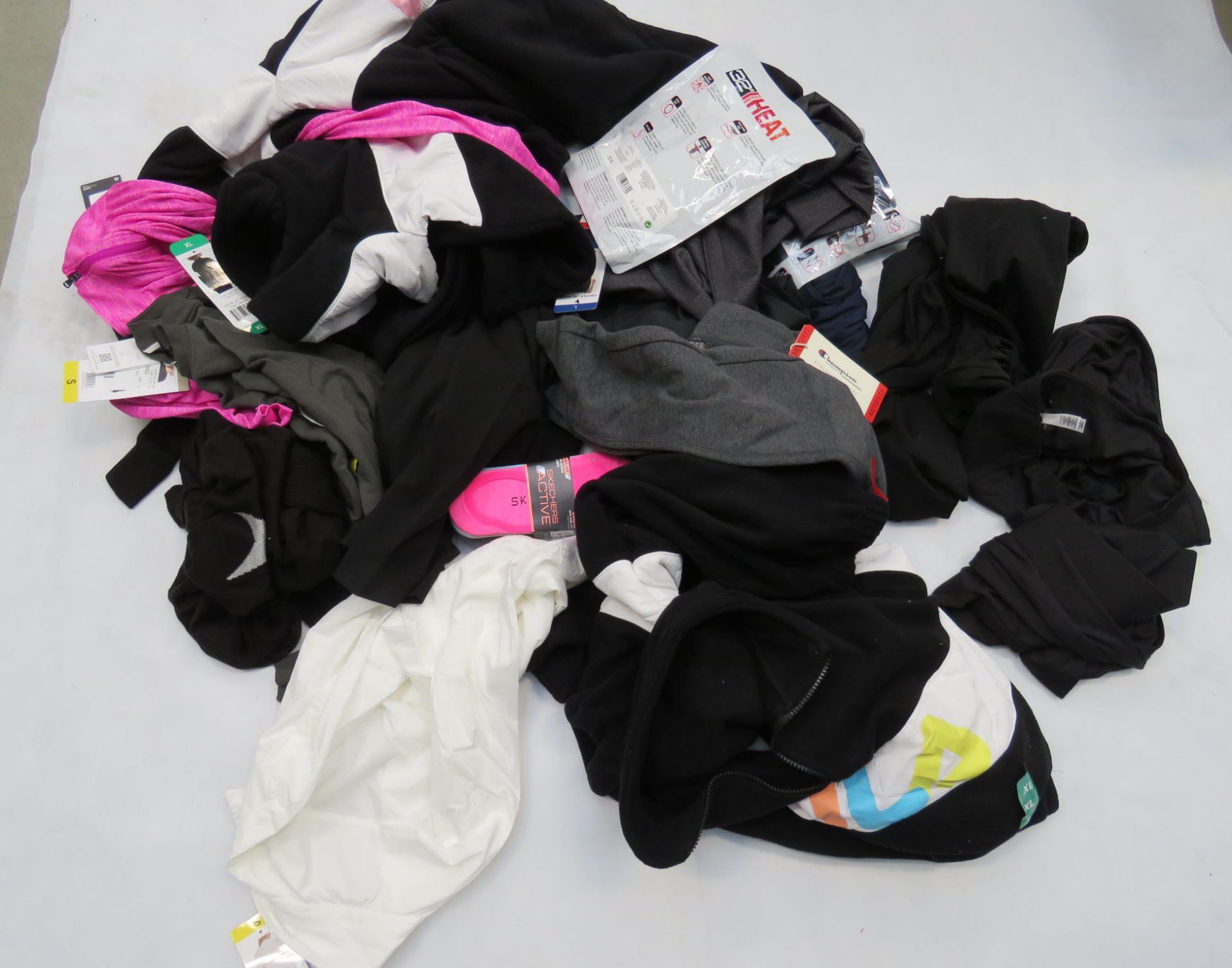 Large bag of mixed ladies clothing incl. trousers, tops, etc.