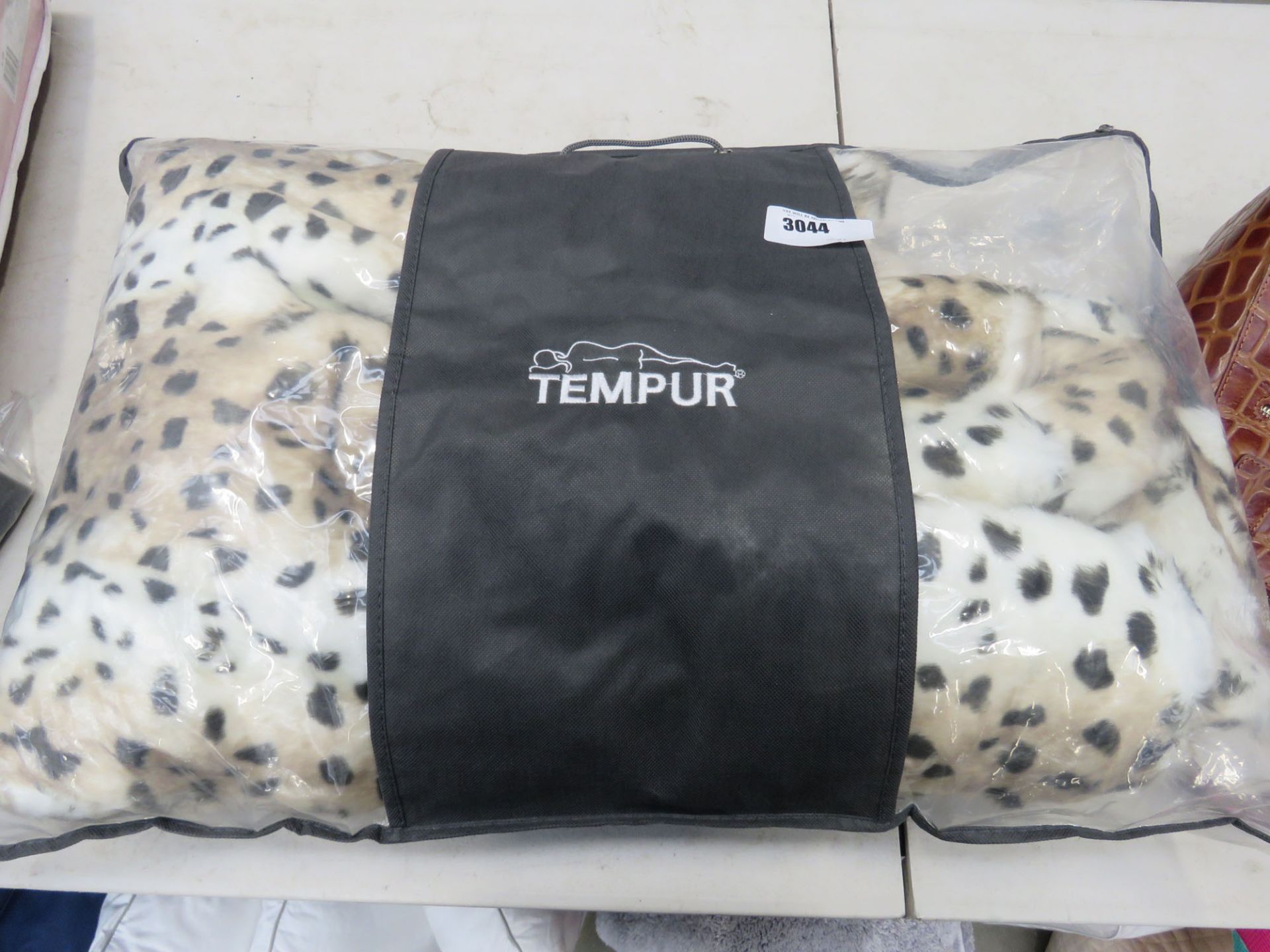 Bag containing heated blanket in a Tempur zipped bag