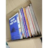 Box of street plans and guides