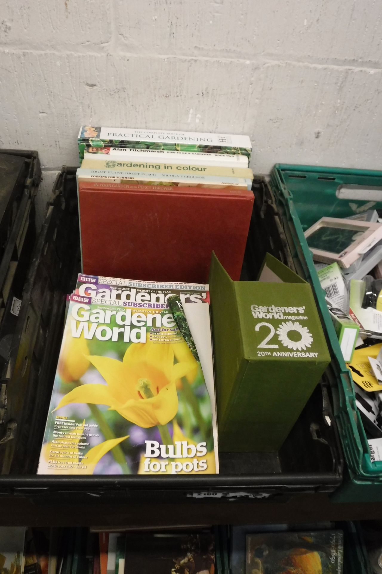 Crate of gardening magazines and books