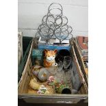 Crate containing wire work wine bottle holder, boxed butterfly pet fountain, ceramic cat figured