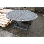 Large grey painted circular wooden table