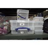 3 transparent storage trays with 8 small storage containers
