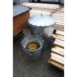 Metal garden bin with assorted metal buckets