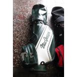 MacGregor leather golf bag with quantity of various golf clubs