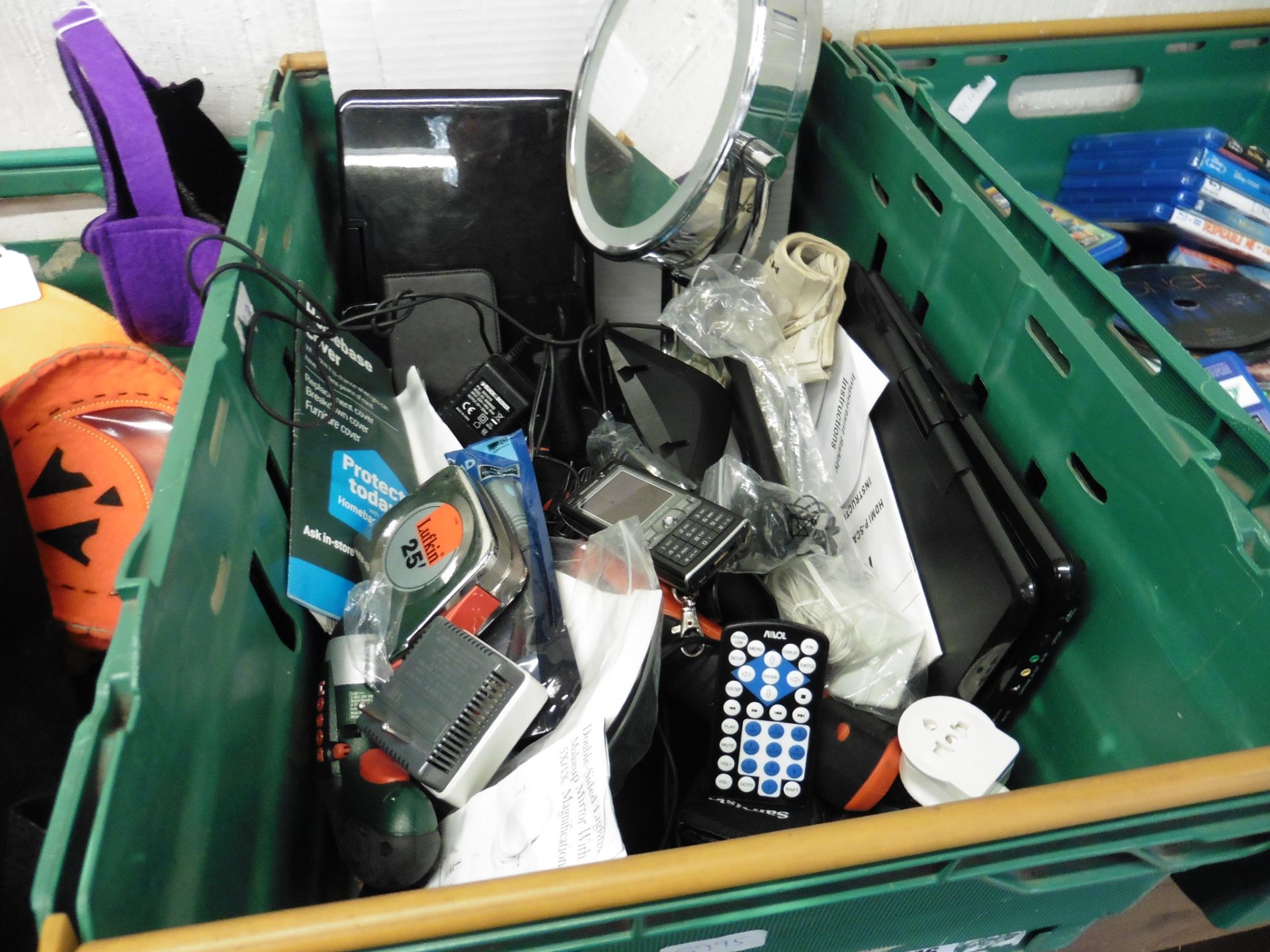 Crate of assorted tape measures, electronics, mirror, etc.