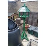 Green painted wooden bird table