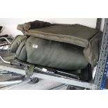 Quantity of Nash fishing equipment incl. folding camping chair, sleeping bag, duffel bag, etc.