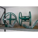 (1051) 2 green hose reels