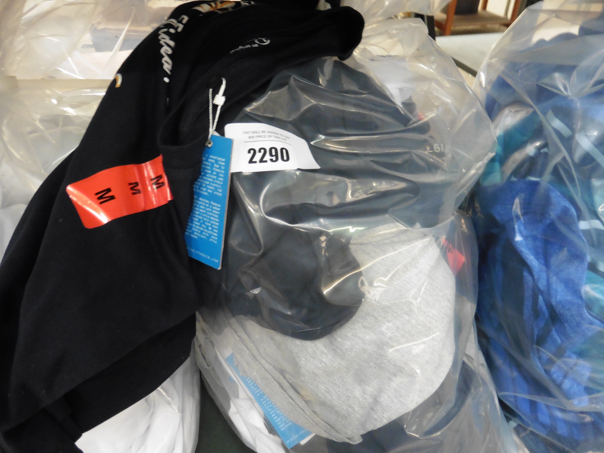 Bag of various sports tops and t-shirts