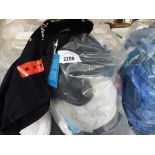 Bag of various sports tops and t-shirts