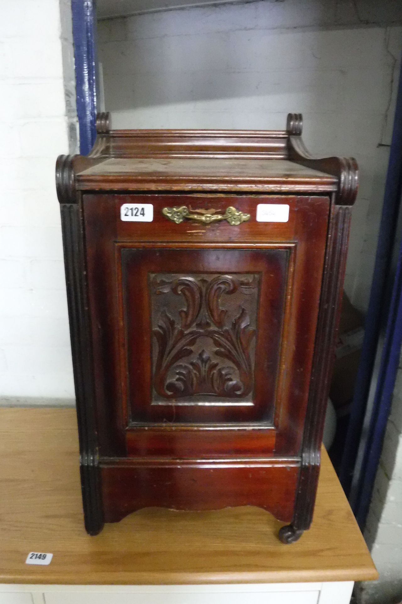 Wooden coal box on castors with flame decoration