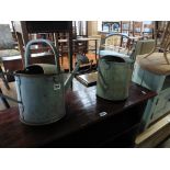 2 galvanized watering cans, 1 with rose