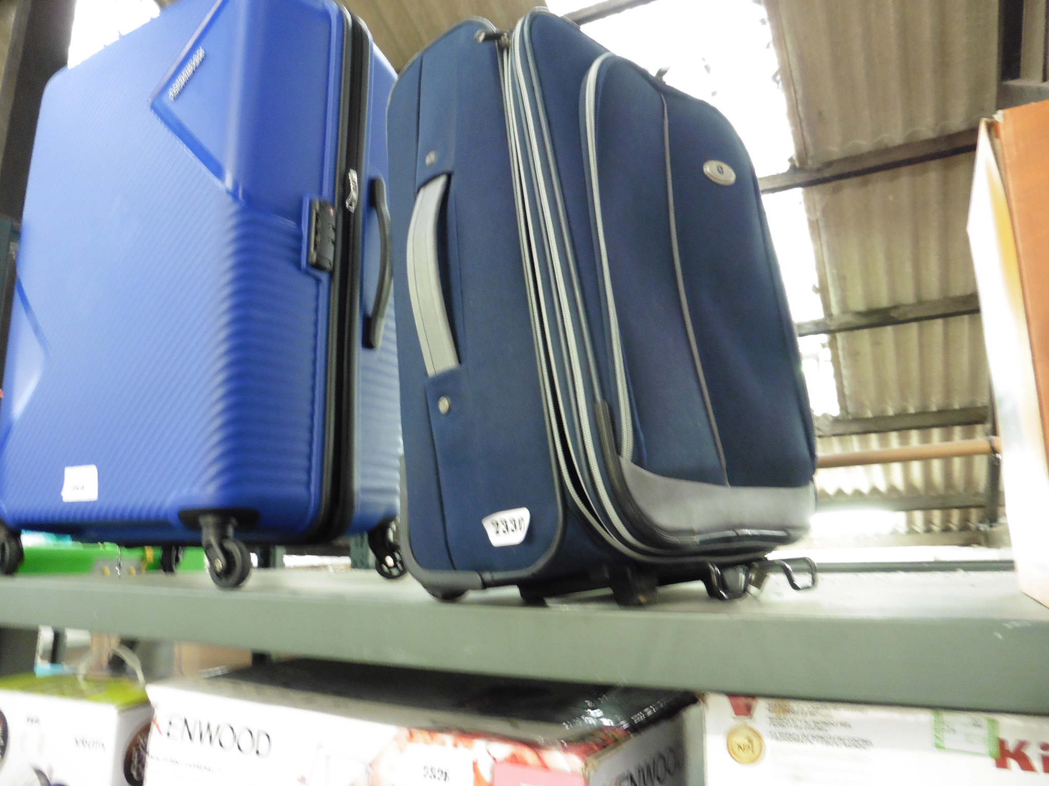 Blue suitcase on wheels