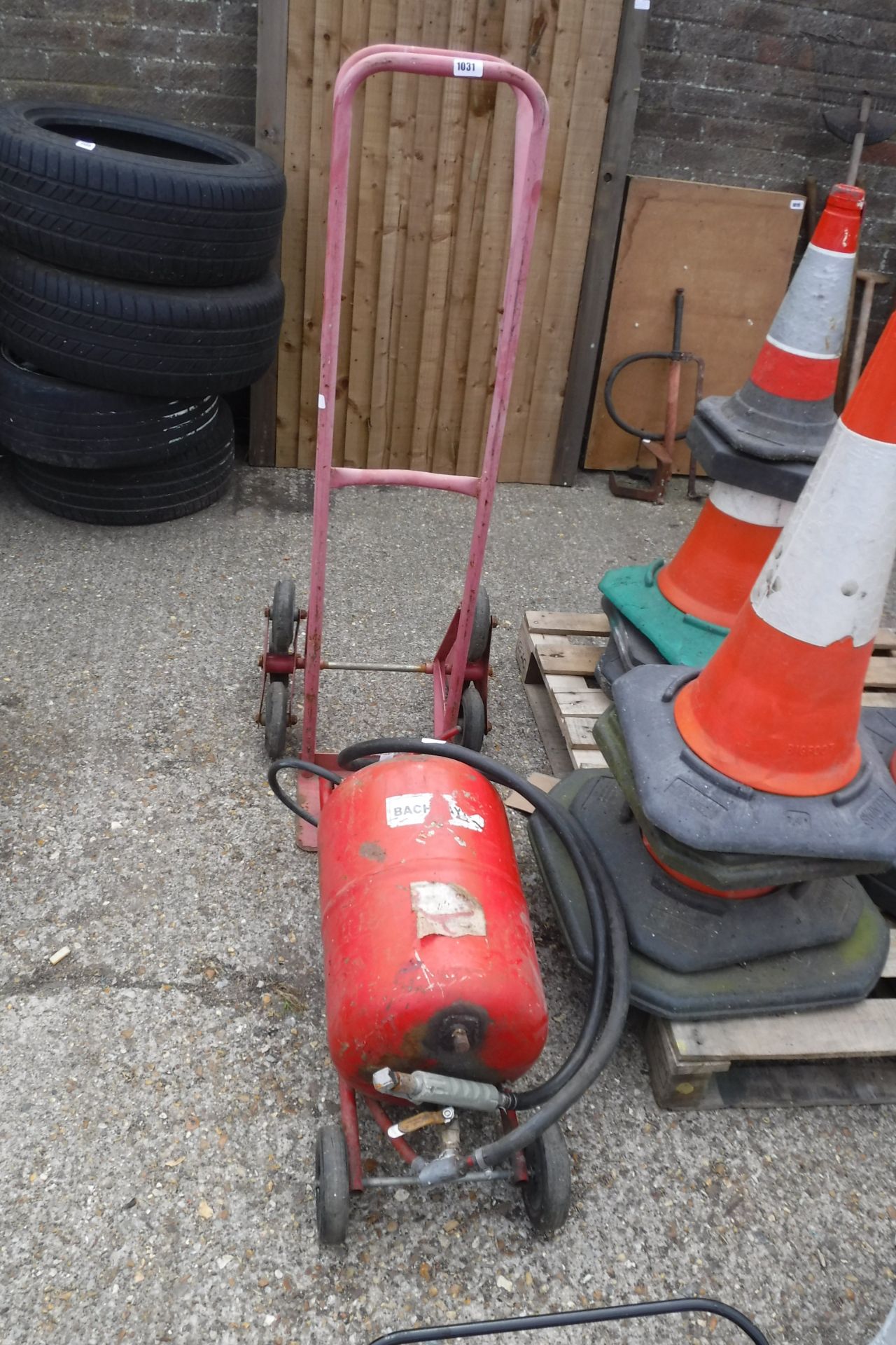 Red 4 wheel sack barrow with sand blasting Machine on trolley