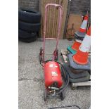 Red 4 wheel sack barrow with sand blasting Machine on trolley