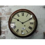 Circular wall clock with Roman numerals to face