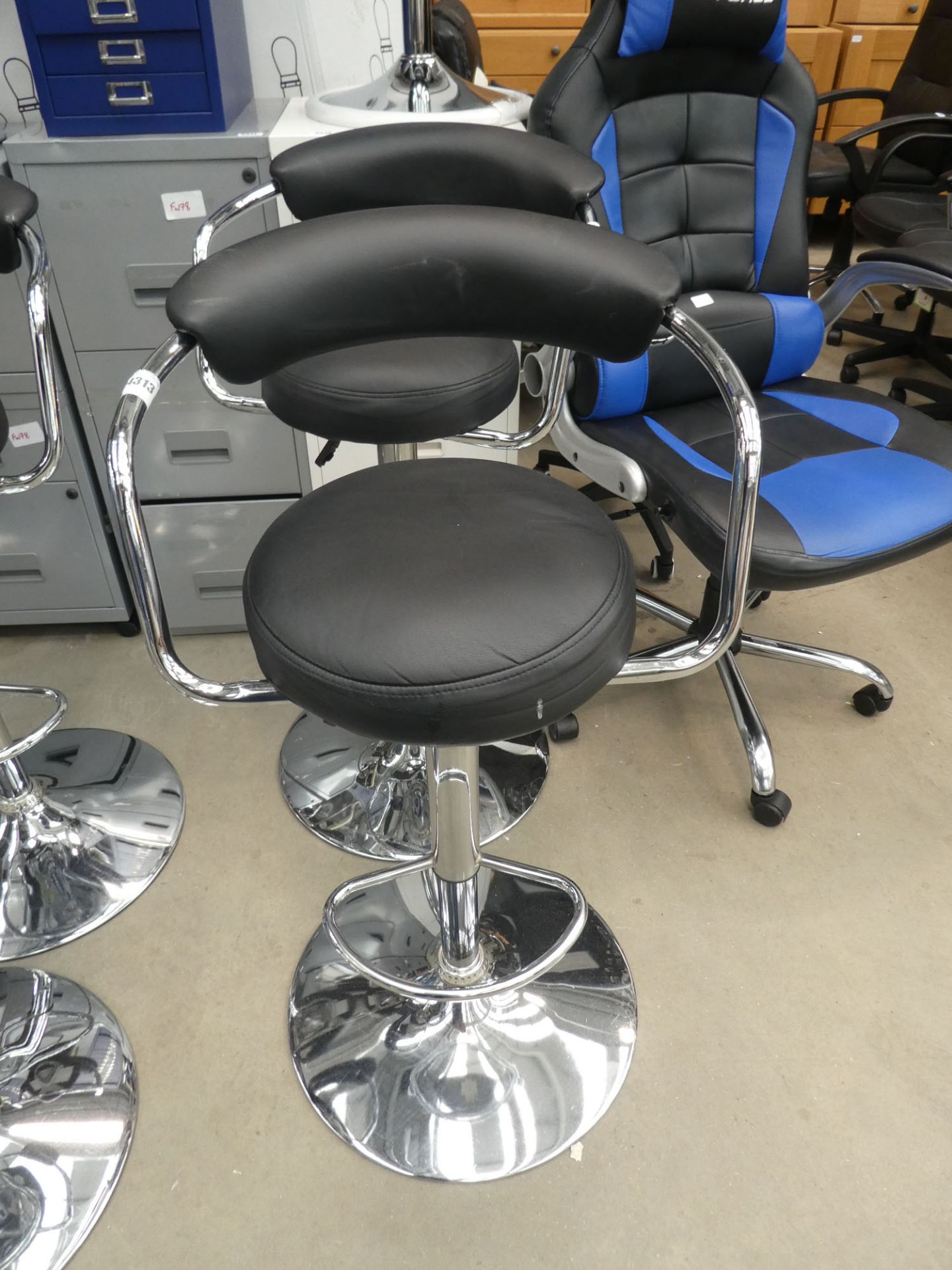 2 black chrome based bar stools