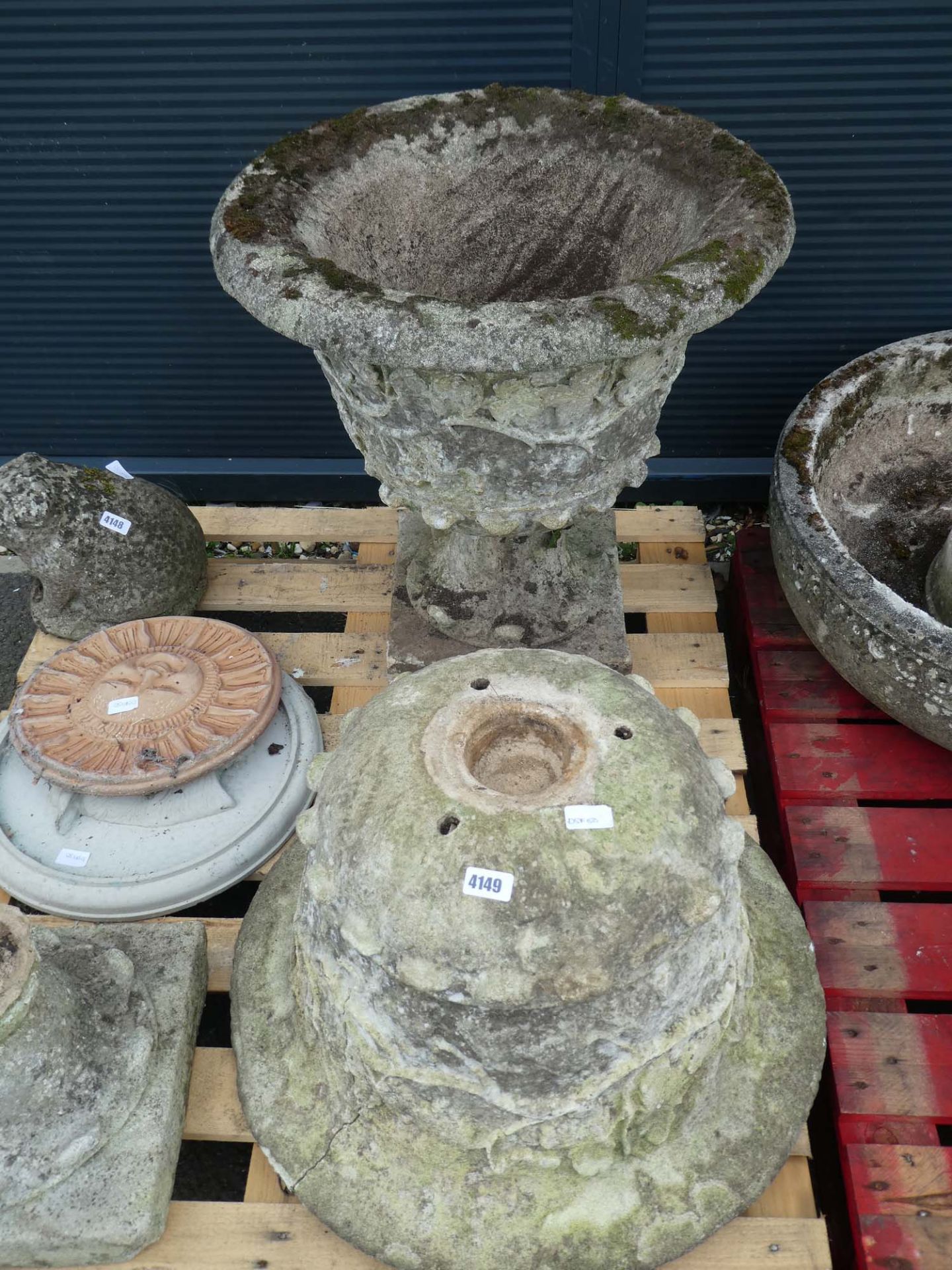 2 large reconstituted stone pots on stands (one with crack to side)