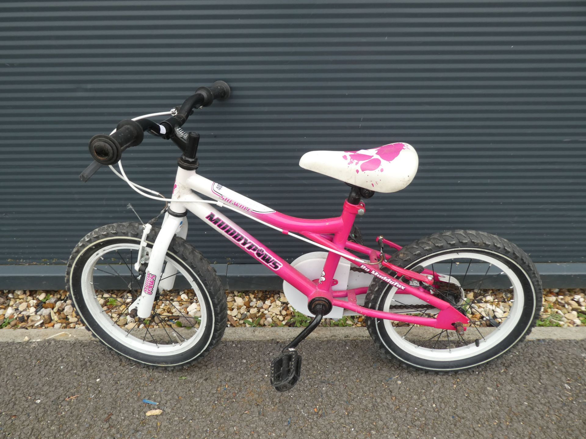 Pink and white Muddyfox child's bike