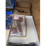2 boxes containing an amber glass dressing table tidy plus dressing table brush and mirror sets