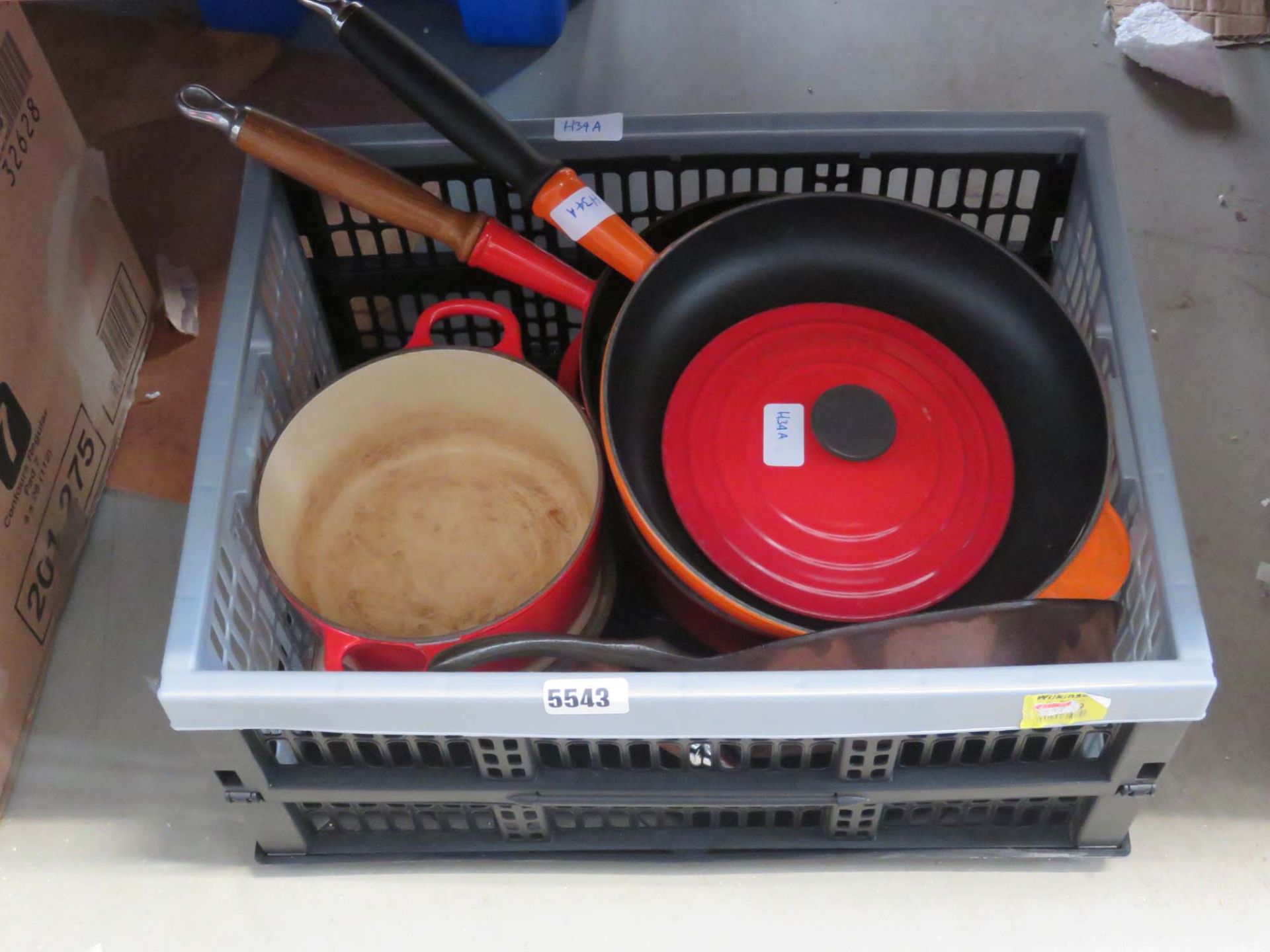 Box containing Le Creusot and other cooking vessels