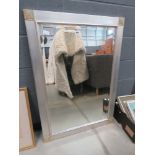 Rectangular bevelled mirror in silver painted frame