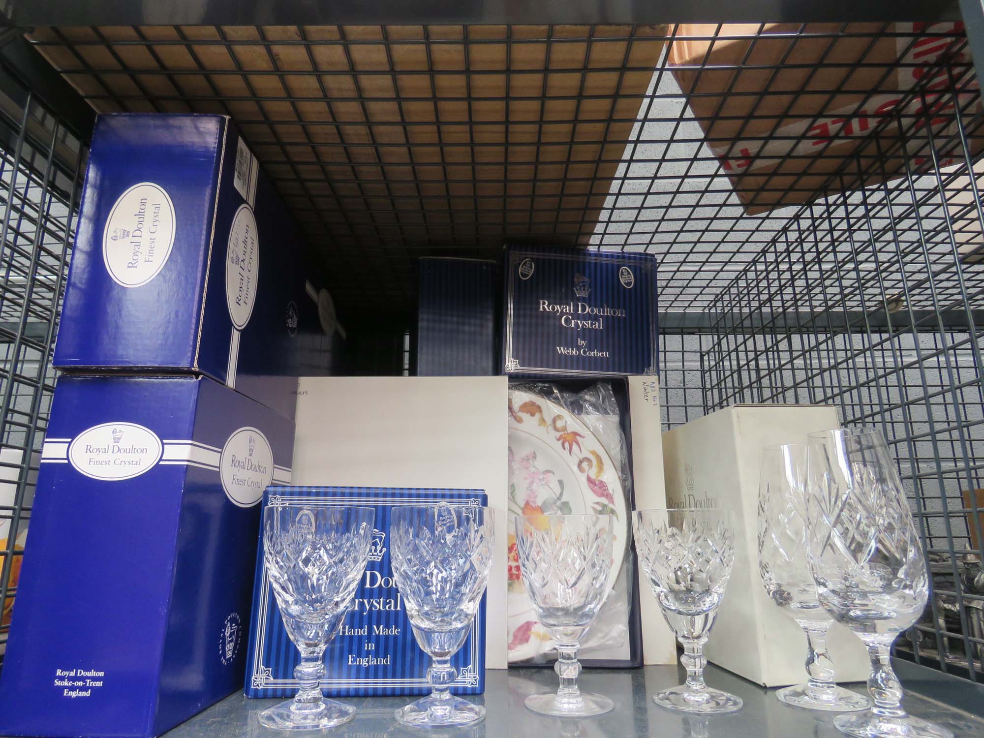 Cage containing a quantity of Royal Doulton crystal wine glasses