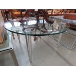 Circular glazed coffee table on chromed supports