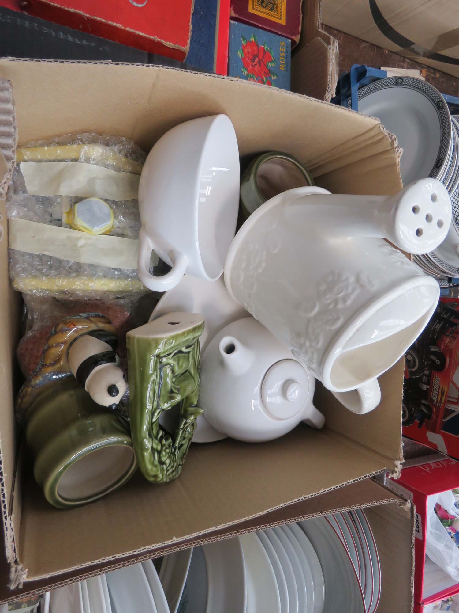 Box containing china to include ornamental watering can, teapot, coffee mug and ornaments