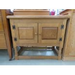 Oak double door cupboard on raised supports