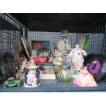 Cage containing ornamental figures, Toby jug, 7'' vinyl records, books, magazines, and biscuit