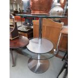 Pair of circular glazed occasional tables