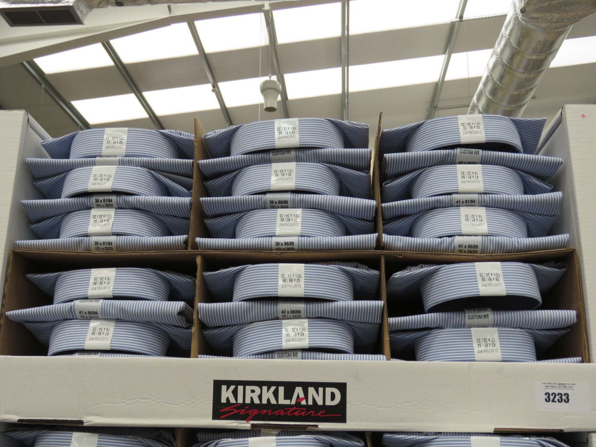 Tray containing large quantity of mens Kirkland Signature shirts