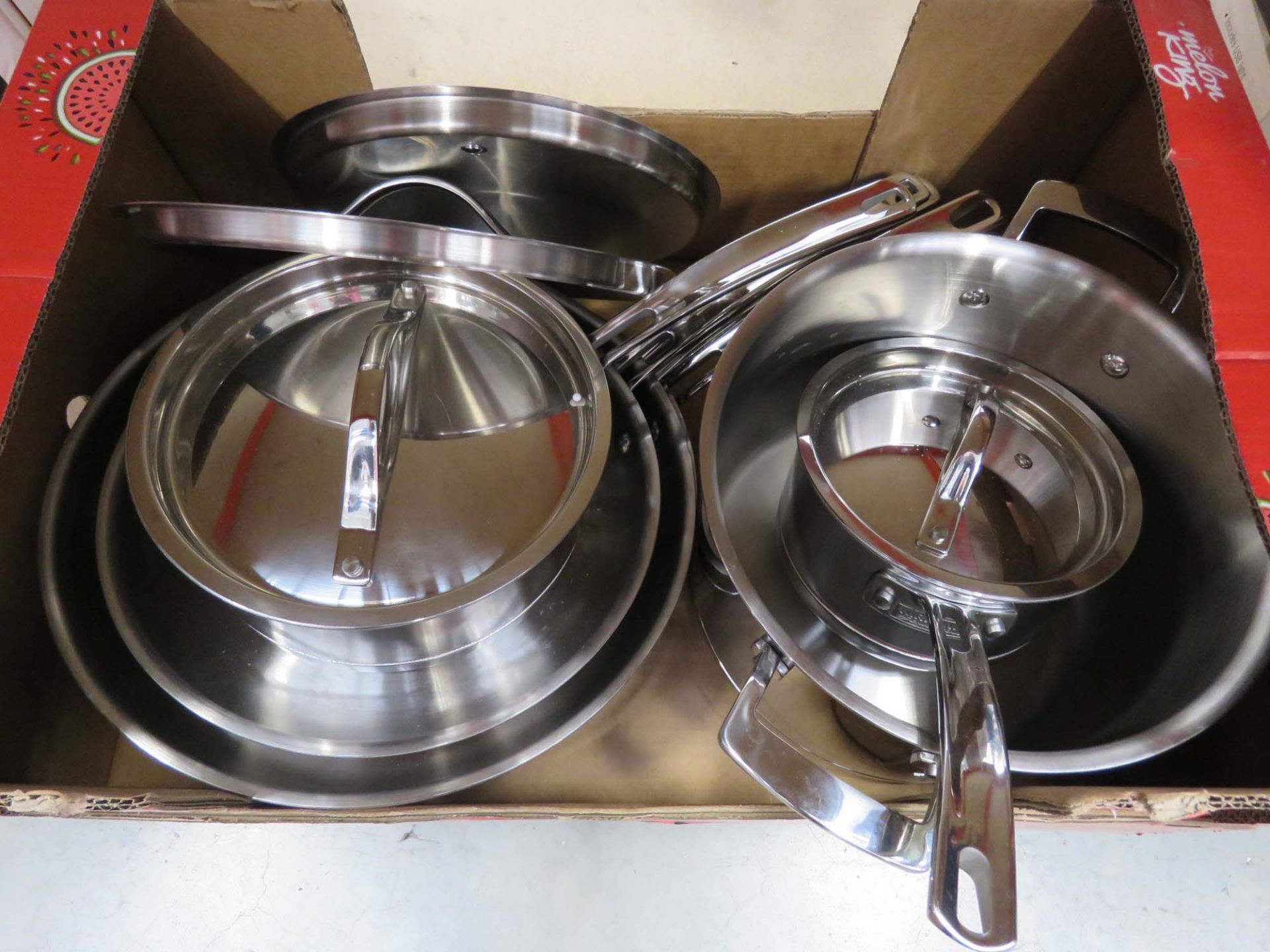 Tray containing mixed Kirkland pots and pans