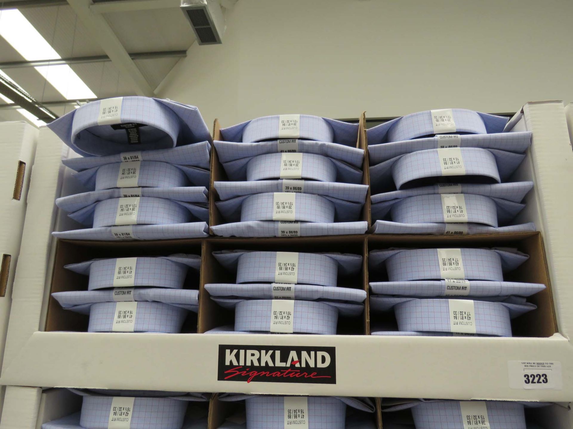 Tray containing large quantity of mens Kirkland Signature shirts