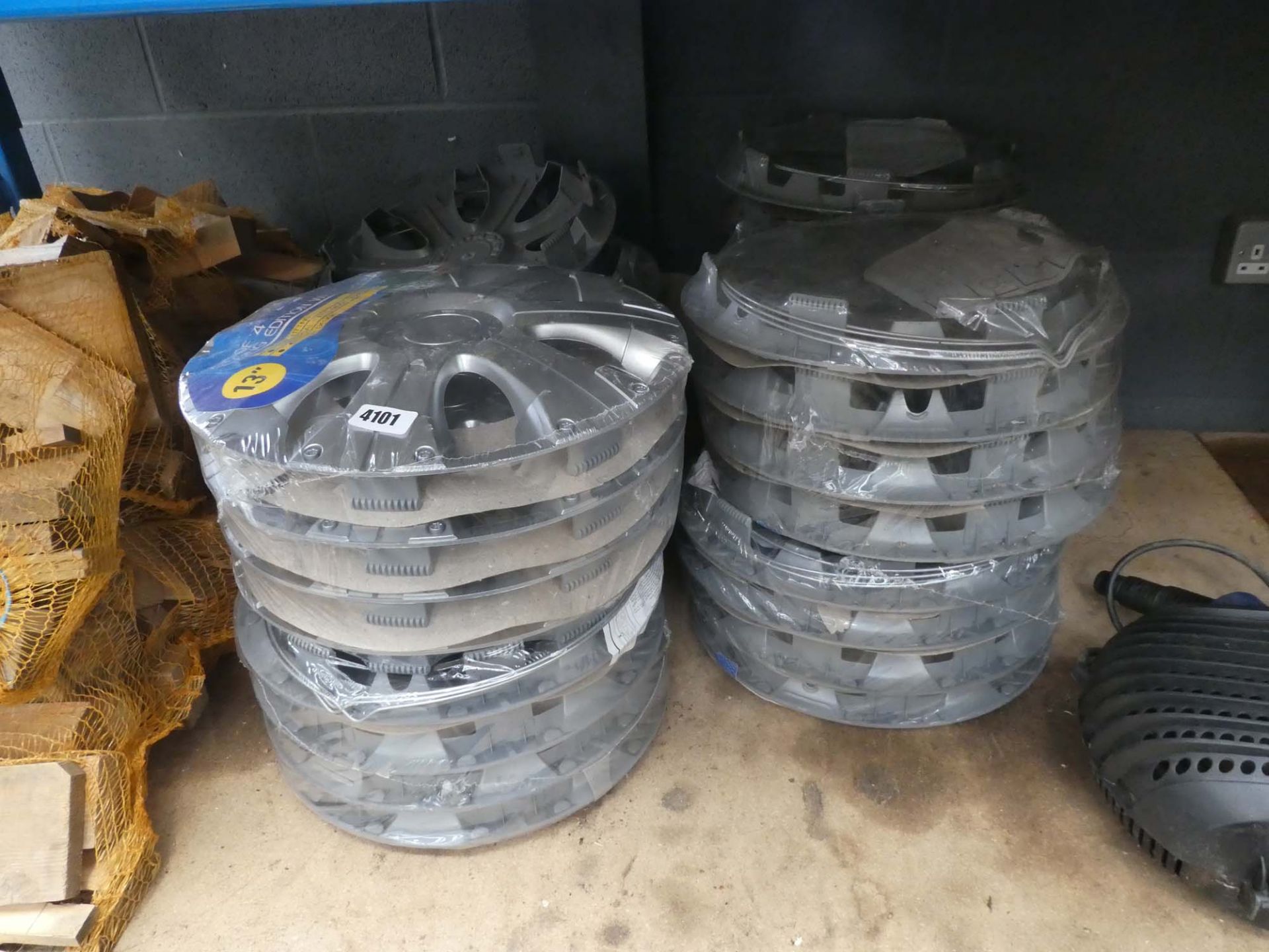 4 stacks of 13'' plastic wheel trims