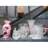 Cage containing glass vases and jugs