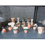 Cage containing miniature Toby jugs plus crested ware and ornamental figures