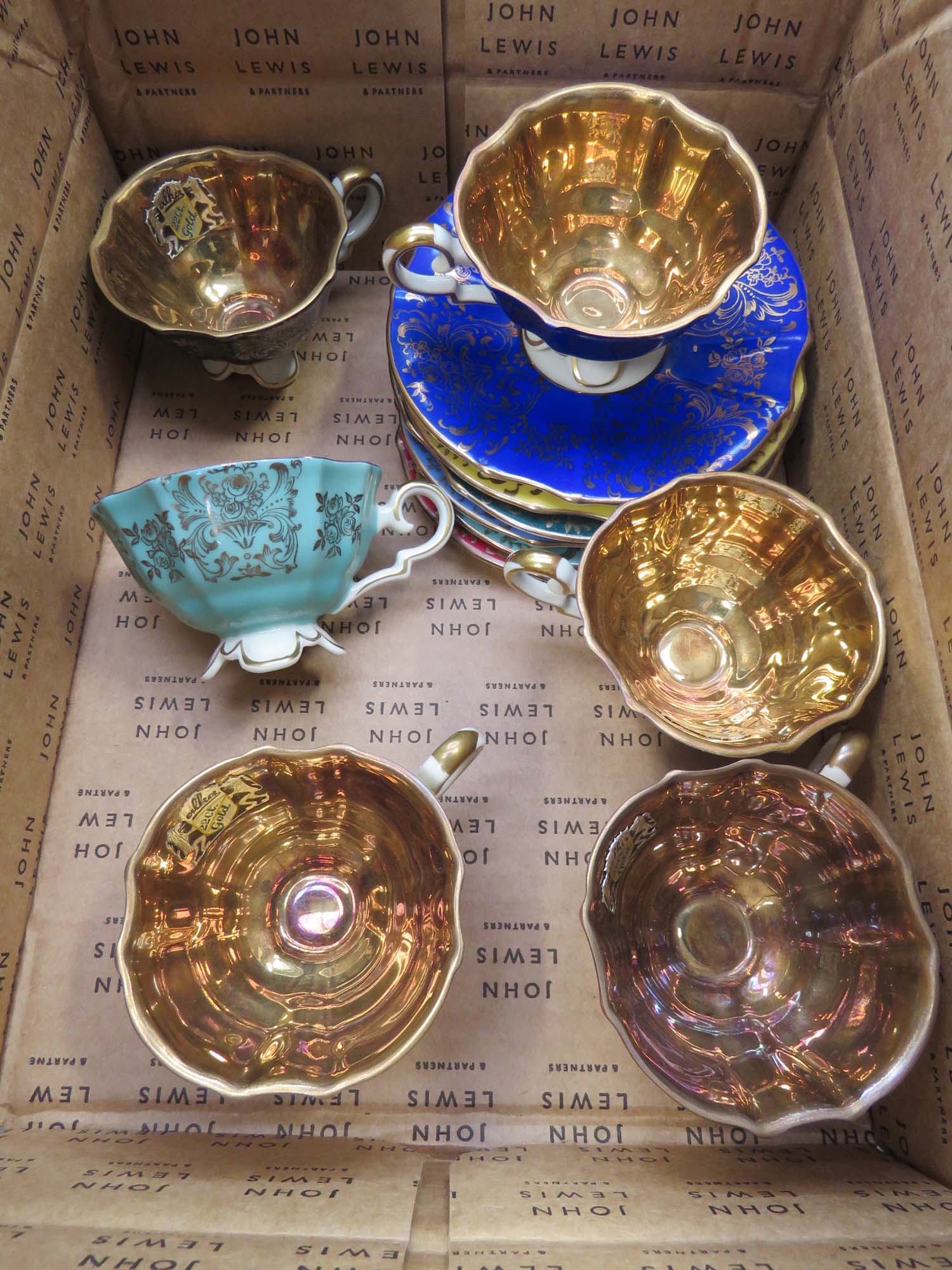 Box containing Bavarian lustre glazed coffee cups and saucers