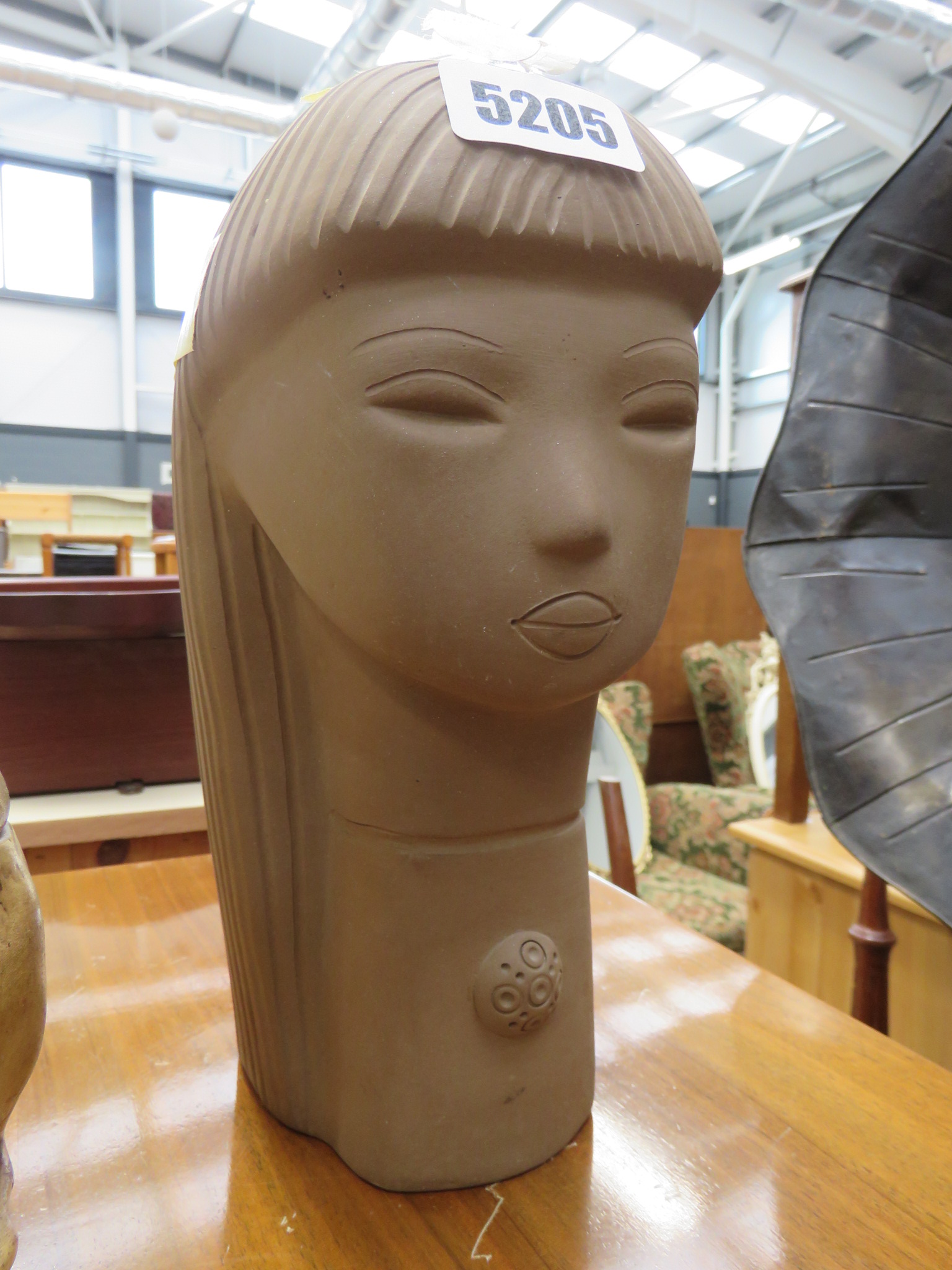 Brown glazed pottery figure of child's head